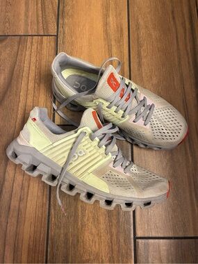 On Cloud Running Athletic Shoes in Beige with Light Green and Orange Accents